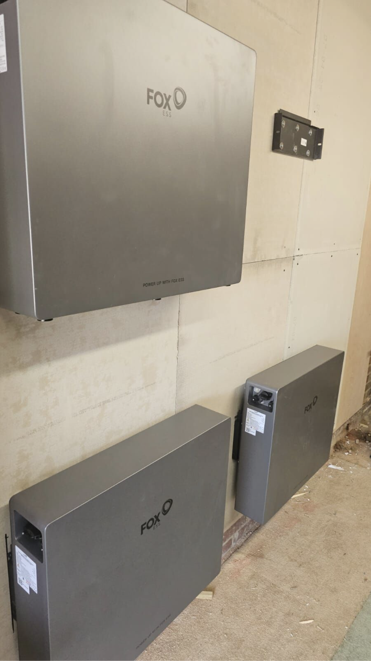 Fox ESS inverter and battery storage units installed on interior wall during solar battery system installation
